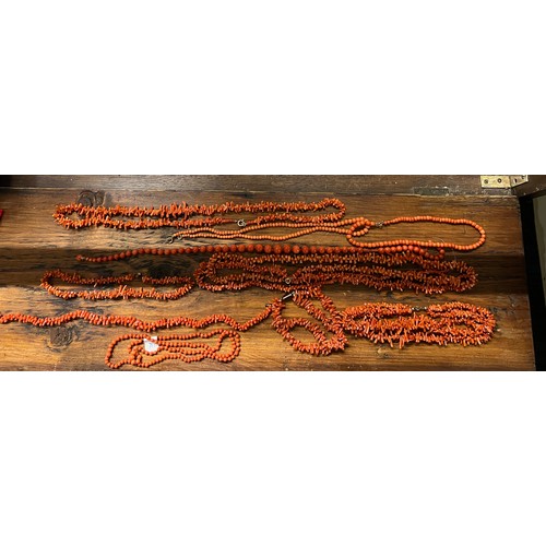 576 - A large quantity of vintage coral beads, some in need of rethreading. One necklace with 9 carat gold... 