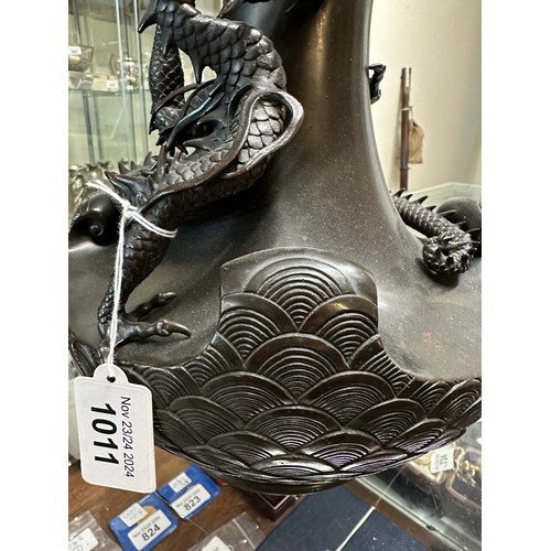 1011 - A Japanese bronze dragon vase, the dragon clutching rock crystal tama. 33cm h.