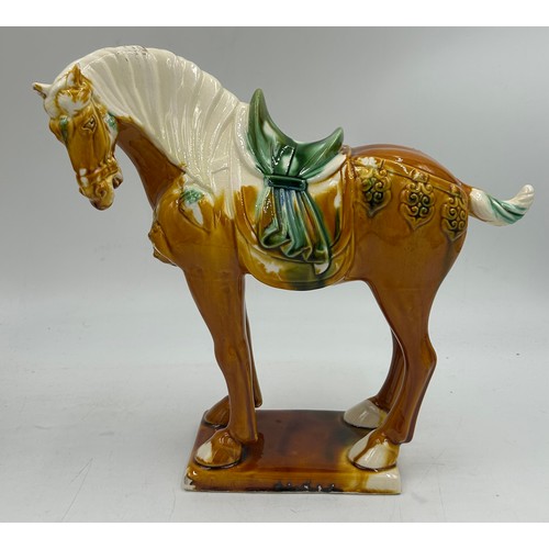 51 - A pair of 20thC Chinese Tang dynasty style horses 28cm h.