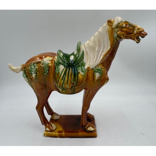 51 - A pair of 20thC Chinese Tang dynasty style horses 28cm h.