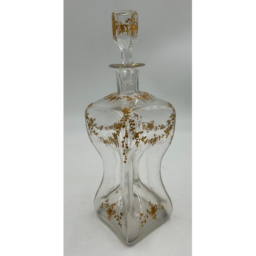 91 - Late 19thC pinched and gilt glass decanter and stopper. Height 29cm.