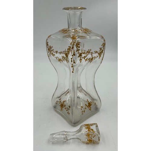 91 - Late 19thC pinched and gilt glass decanter and stopper. Height 29cm.