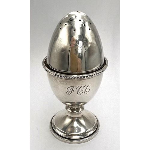 22 - Hallmarked silver egg cup, Birmingham 1947, 6cm h together with an egg shaped pepper pot with weight... 