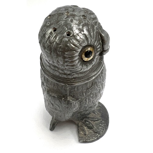 107 - A 19thC pewter pounce pot in the form of an owl with glass eyes. 8cm h.