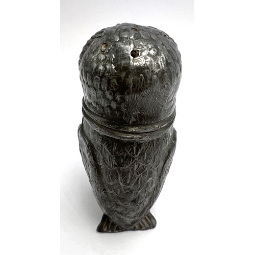 107 - A 19thC pewter pounce pot in the form of an owl with glass eyes. 8cm h.