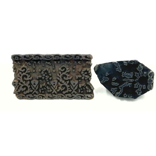 108 - Two 19thC Indian carved wooden fabric printing blocks. Largest 15cm x 8.5cm.