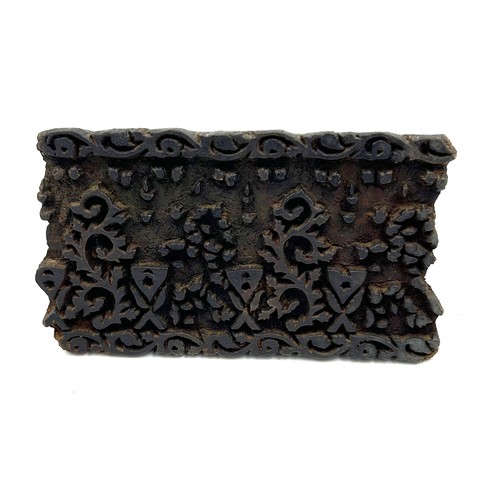 108 - Two 19thC Indian carved wooden fabric printing blocks. Largest 15cm x 8.5cm.