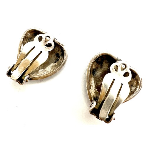 149 - A pair of Art Deco style .925 silver and marcasite heart shaped clip on earrings.