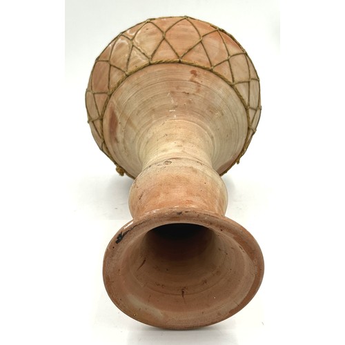 223 - A 1970’s African terracotta bongo drum. 33cm h.