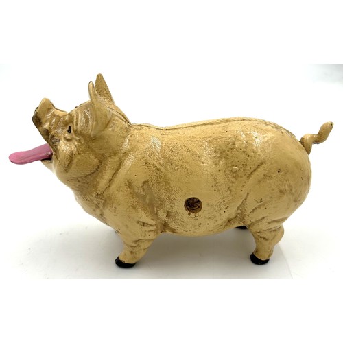 253 - A vintage cast iron pig money box. 20cm l.