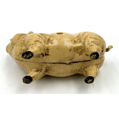 253 - A vintage cast iron pig money box. 20cm l.