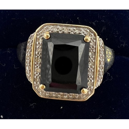 254 - A nine carat gold ring set with sapphire and diamonds. Size S. Weight 4.6gm.