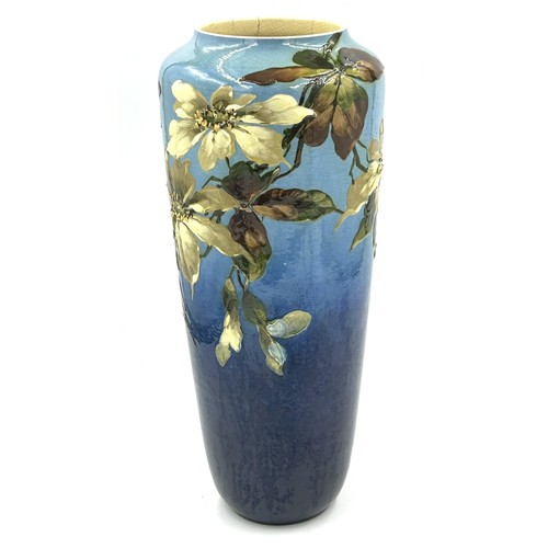 283 - A late 19thC Leeds Art vase with floral decoration on a blue ground. 42cm h.