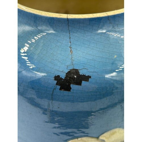 283 - A late 19thC Leeds Art vase with floral decoration on a blue ground. 42cm h.