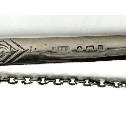 120 - A hallmarked silver letter opener on suspension chain in the form of a sword. Birmingham 1904, maker... 