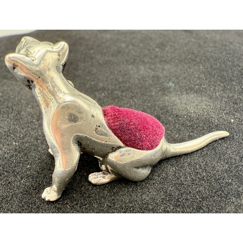 312 - A scratching cat sterling silver pincushion. 6cm l.