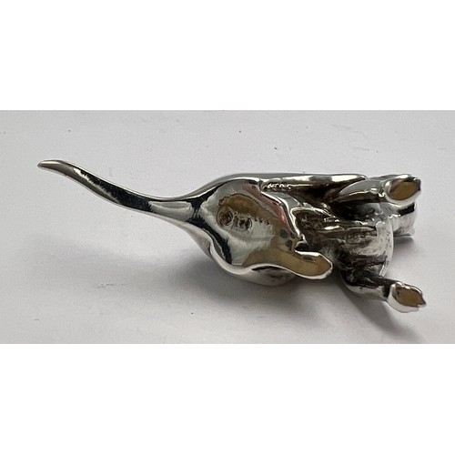 312 - A scratching cat sterling silver pincushion. 6cm l.