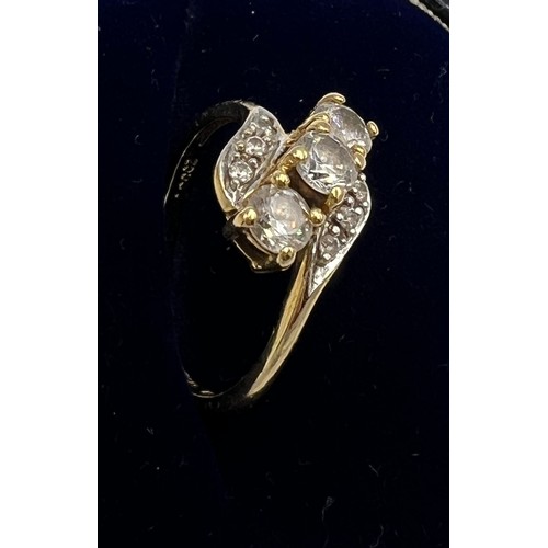 526 - An 18 carat gold QVC ring set with CZ, size N, weight 3.1gm.