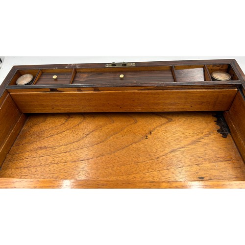 902 - A Rosewood Writing Slope inlaid with mother of pearl and brass carrying handles complete with fitted... 