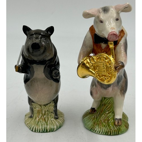 342 - Nine John Beswick pig orchestra figures comprising, Richard with French horn, Matthew with trumpet, ... 