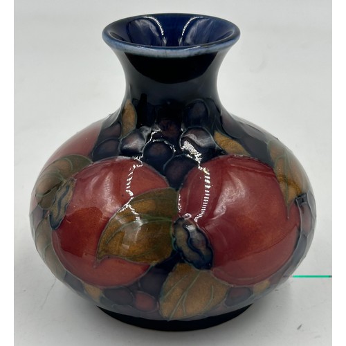 343 - Two Moorcroft vases in the Pomegranate pattern monogram and impressed marks to base, one with sticke... 