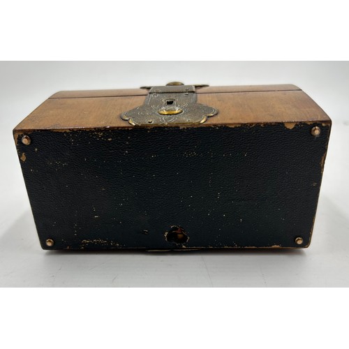 901 - A 19thC domed brass bound box containing three glass perfume bottles with gilt decoration. Labels to... 