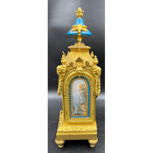 982 - A 19thC French gilt metal and porcelain mantle clock, striking on a bell. 42cm h. Marked to works Wa... 