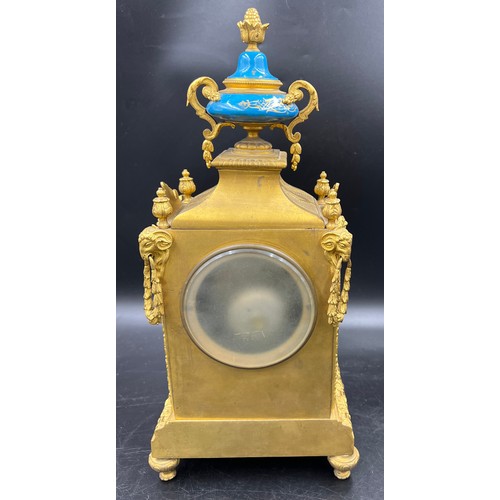 982 - A 19thC French gilt metal and porcelain mantle clock, striking on a bell. 42cm h. Marked to works Wa... 