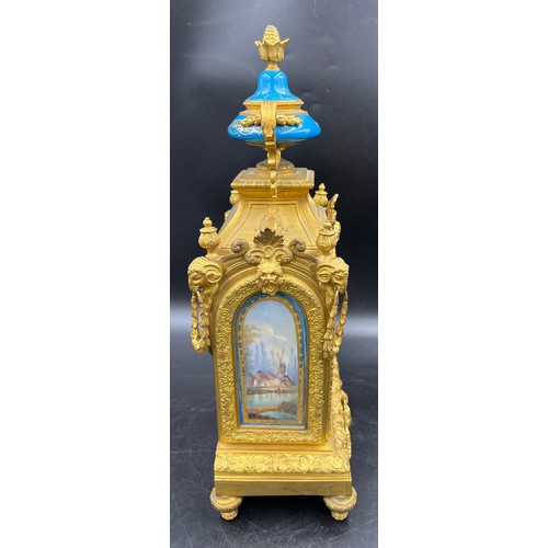 982 - A 19thC French gilt metal and porcelain mantle clock, striking on a bell. 42cm h. Marked to works Wa... 