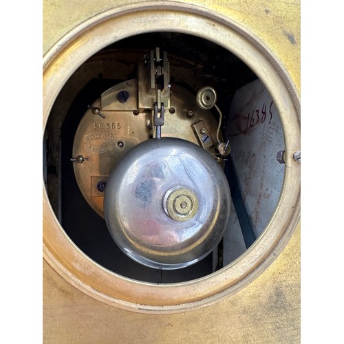 982 - A 19thC French gilt metal and porcelain mantle clock, striking on a bell. 42cm h. Marked to works Wa... 