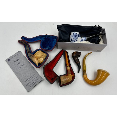 1171 - Five pipes to include two meerschaum both with amber stems, one with white metal mounts in fitted ca... 