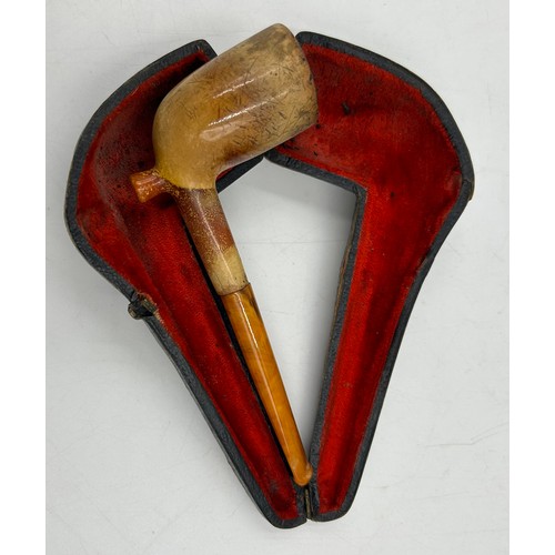 1171 - Five pipes to include two meerschaum both with amber stems, one with white metal mounts in fitted ca... 