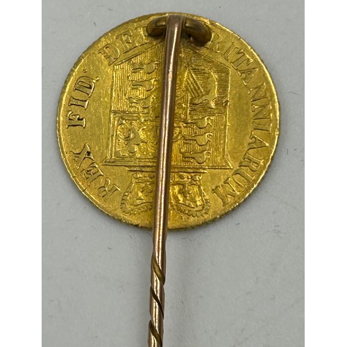 721 - An 1817 George III gold half sovereign with shield back soldered to form a stick pin. Total weight 4... 