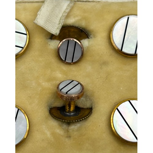 537 - A 9ct gold and mother-of-pearl dress shirt set, comprising a pair of cuff links, 2 x dress studs and... 