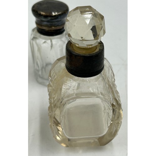 774 - A collection of 5 silver topped/collared scent bottles and 3 others. Tallest 14.5cm. Most a/f.