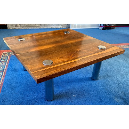 23 - A Pieff rosewood and chrome coffee table. 90cm x 90cm.