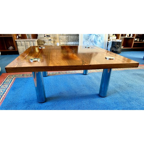 23 - A Pieff rosewood and chrome coffee table. 90cm x 90cm.