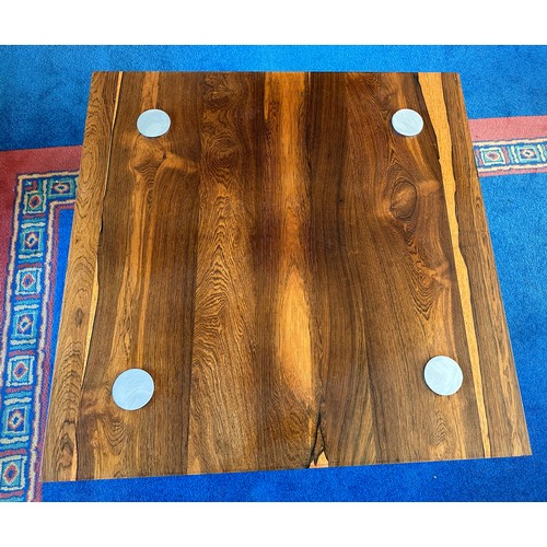 23 - A Pieff rosewood and chrome coffee table. 90cm x 90cm.