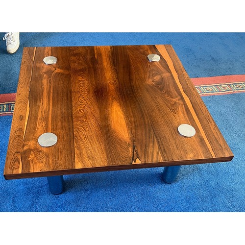 23 - A Pieff rosewood and chrome coffee table. 90cm x 90cm.