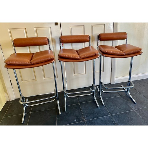 24 - Three Pieff chrome and brown vinyl bar stools. Height to back 85.5cm. 43cm wide. 46.5cm d.