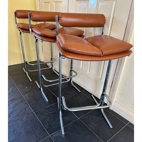 24 - Three Pieff chrome and brown vinyl bar stools. Height to back 85.5cm. 43cm wide. 46.5cm d.