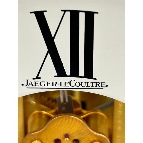 983 - A Jaeger le Coultre Atmos clock, gilt brass cased, white chapter ring, Roman numerals, fifteen jewel... 