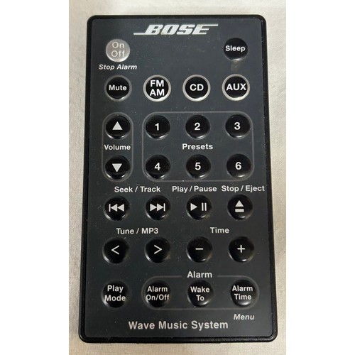 948 - A Bose wave music system with remote control serial number 049851393300025AE together with a Wave Da... 