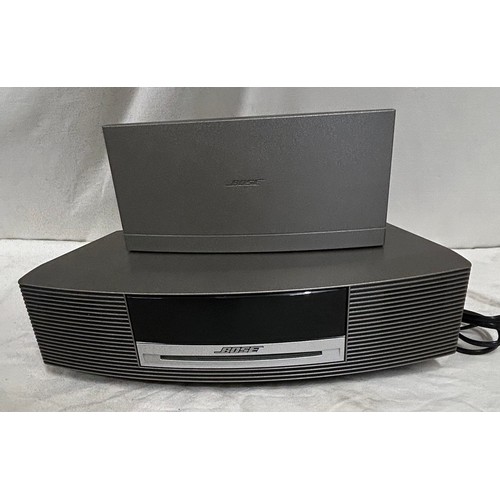 948 - A Bose wave music system with remote control serial number 049851393300025AE together with a Wave Da... 