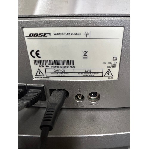 948 - A Bose wave music system with remote control serial number 049851393300025AE together with a Wave Da... 