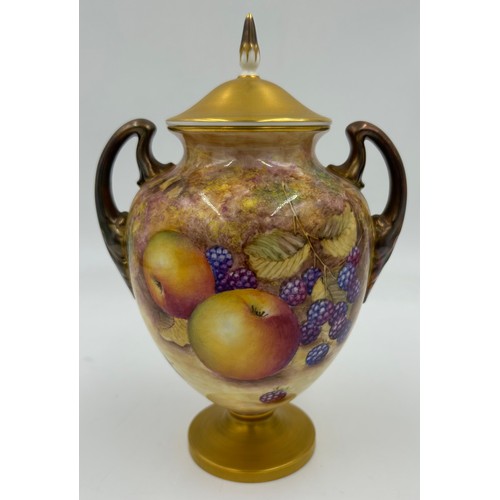 369 - A pair of Royal Worcester porcelain urn shaped vases painted with assorted fruit, one signed C. Hugh... 