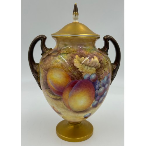 369 - A pair of Royal Worcester porcelain urn shaped vases painted with assorted fruit, one signed C. Hugh... 