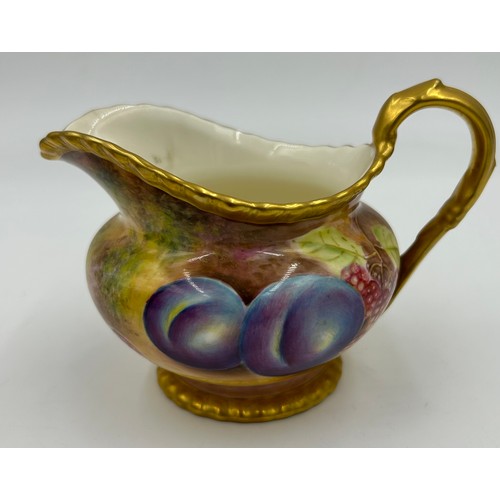 374 - A Royal Worcester sugar bowl 11.5cm d and milk jug 9cm h decorated with plums and berries on a moss ... 