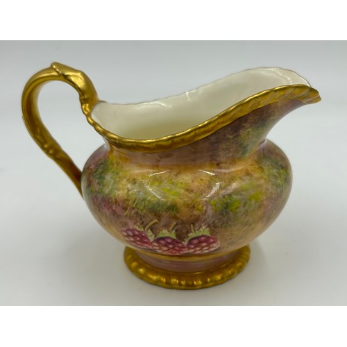 374 - A Royal Worcester sugar bowl 11.5cm d and milk jug 9cm h decorated with plums and berries on a moss ... 