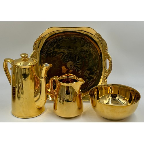 381 - A Noritake part tea set in gold comprising of a cake plate, 6 x cups & saucers, 6 x tea plates, suga... 